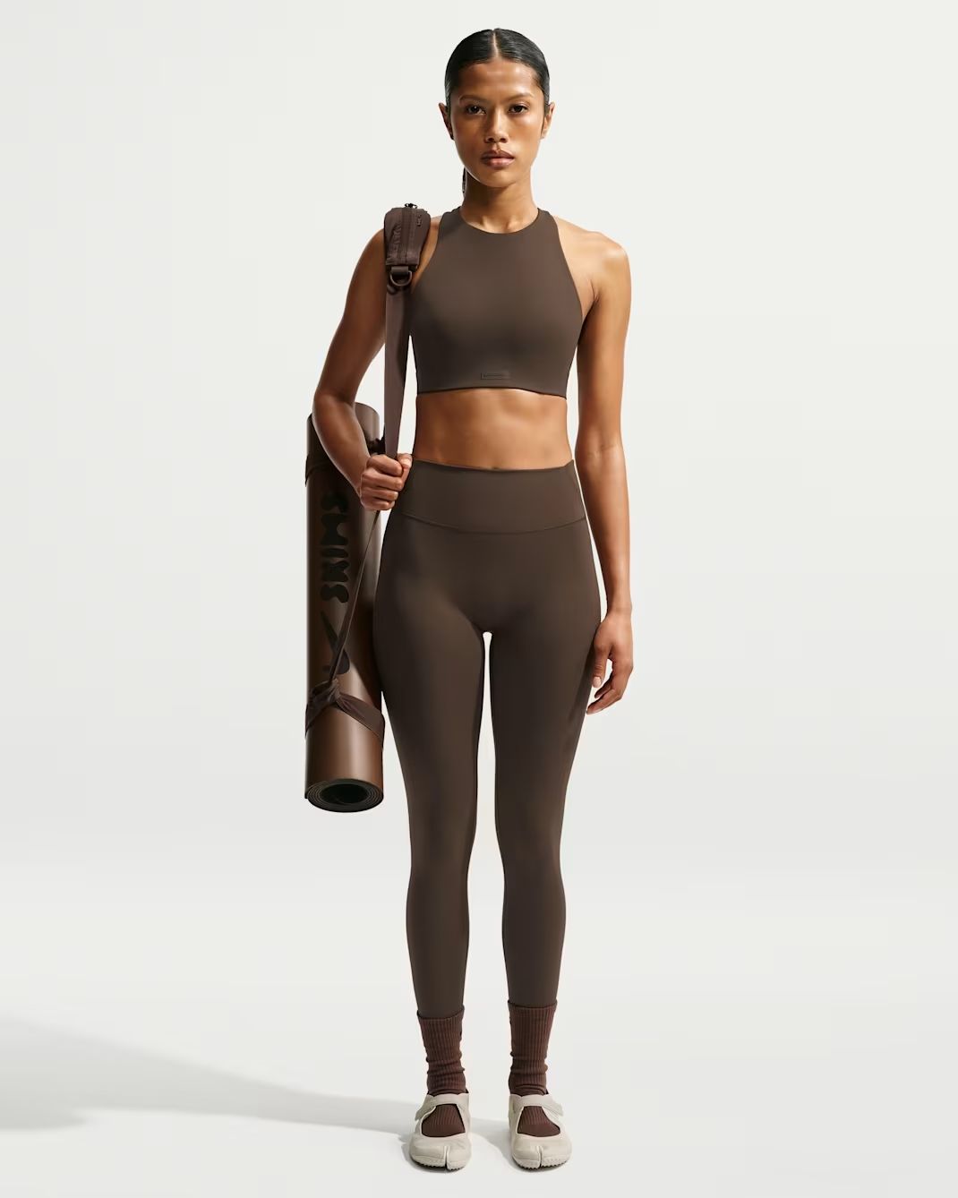 NikeSKIMS yoga mat product detail for the FAQ section